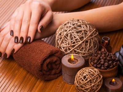 brown manicure on a bamboo background