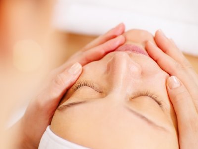 Woman under facial spa procedure